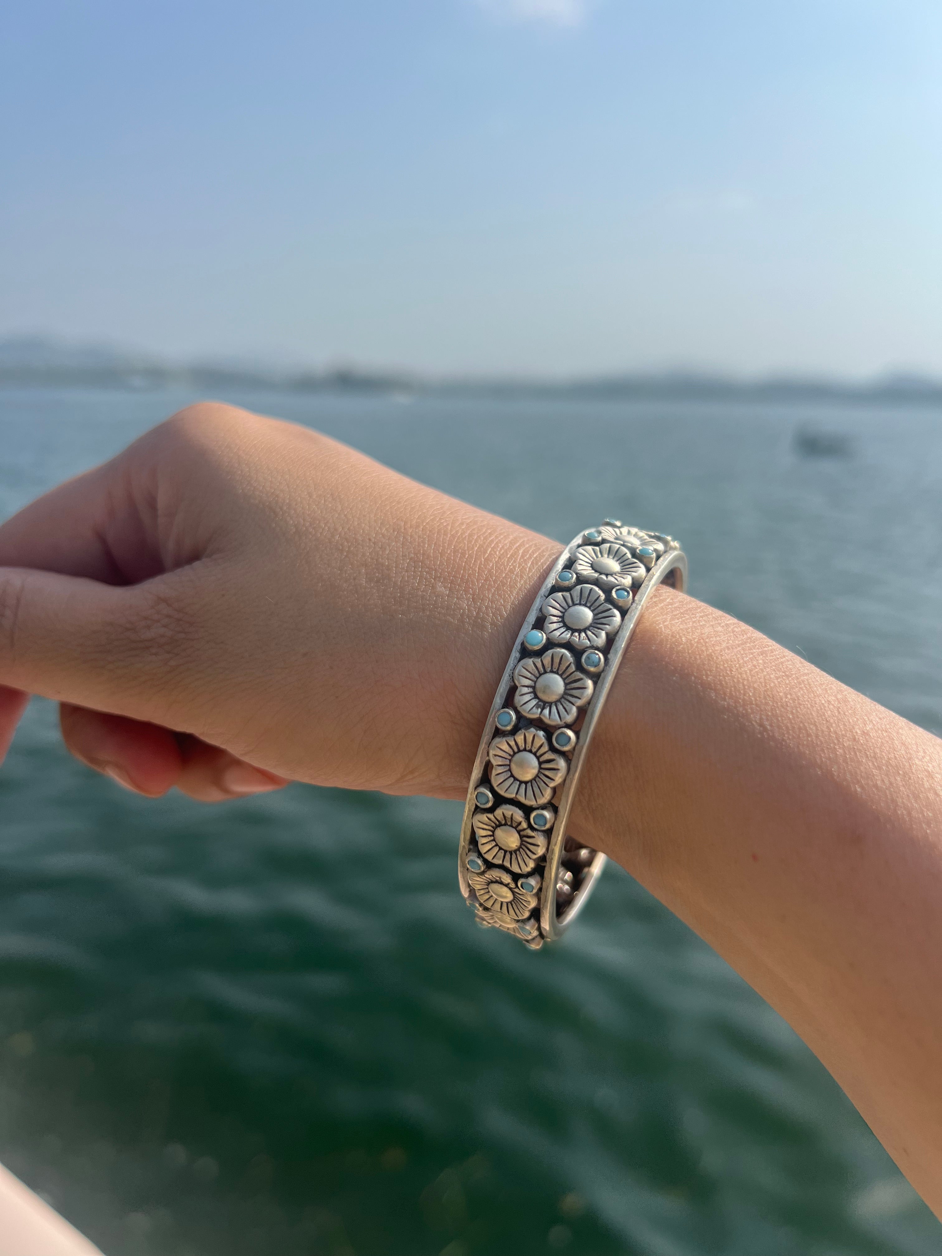 Silver floral with blue dots kada